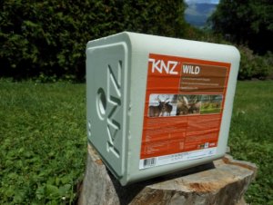 Salt lick on a wooden block outdoors |